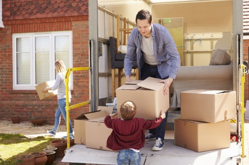 Removal van and moving team preparing a West Kensington home move