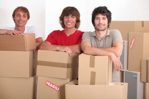 Team packing desks and equipment for an office move in West Kensington