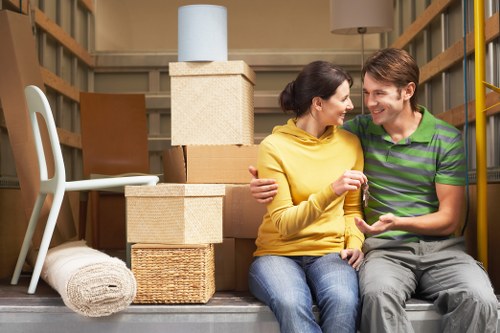 Packing and loading furniture into a moving van in West Kensington